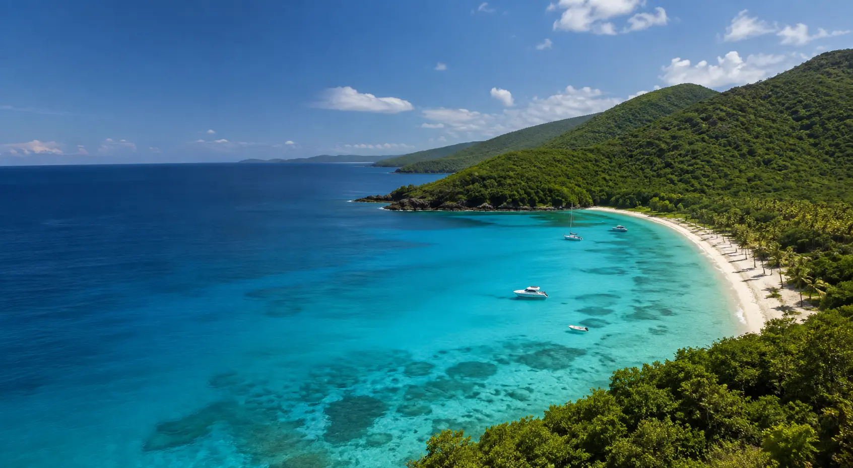 Turquoise Caribbean bay and green island hills